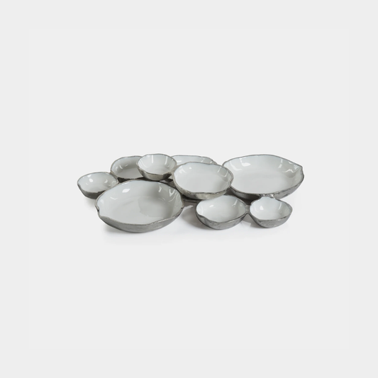 Cluster of Nine Round Serving Bowls in Nickel and White